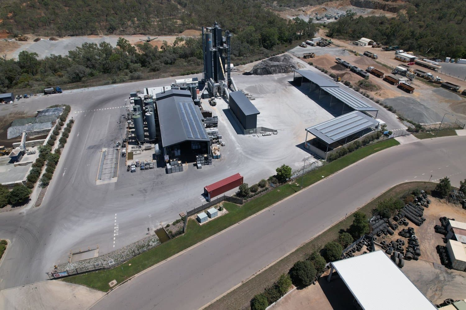 Aerial view of an industrial facility with a large workshop shed
